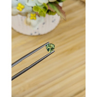 0.76 Ct. Yellowish Green Sapphire from Madagascar Life Style