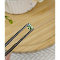 0.56 Ct. Yellowish Green Sapphire from Madagascar Life Style