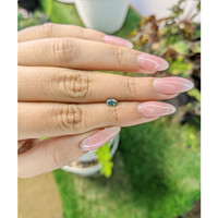 0.42 Ct. Bluish Green Sapphire from Madagascar Life Style