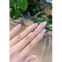 1.57 Ct. Yellowish Green Sapphire from Madagascar Life Style