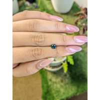 0.81 Ct. Greenish Blue Sapphire from Madagascar Life Style