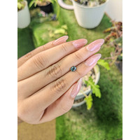 0.68 Ct. Bluish Green Sapphire from Madagascar Life Style