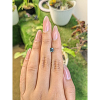 0.68 Ct. Bluish Green Sapphire from Madagascar Life Style