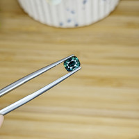 0.68 Ct. Bluish Green Sapphire from Madagascar Life Style