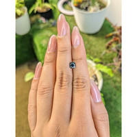 0.81 Ct. Greenish Blue Sapphire from Madagascar Life Style