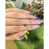 0.72 Ct. Bluish Green Sapphire from Madagascar Life Style