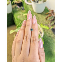 0.68 Ct. Bluish Green Sapphire from Madagascar Life Style