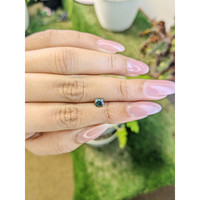 0.68 Ct. Bluish Green Sapphire from Madagascar Life Style