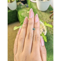 0.56 Ct. Yellowish Green Sapphire from Madagascar Life Style