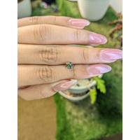 0.67 Ct. Yellowish Green Sapphire from Madagascar Life Style