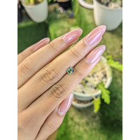 0.67 Ct. Yellowish Green Sapphire from Madagascar Life Style