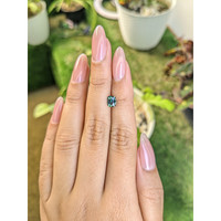 0.85 Ct. Bluish Green Sapphire from Madagascar Life Style