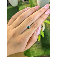 0.85 Ct. Bluish Green Sapphire from Madagascar Life Style