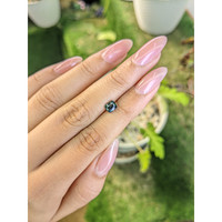 0.84 Ct. Greenish Blue Sapphire from Madagascar Life Style