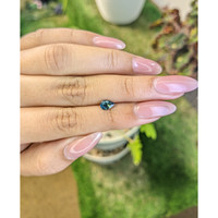 0.79 Ct. Greenish Blue Sapphire from Madagascar Life Style