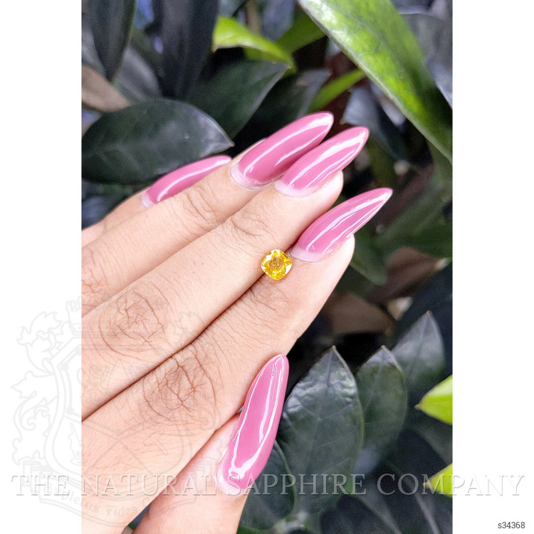 0.66 Ct. Orangish Yellow Sapphire from Ceylon (Sri Lanka)