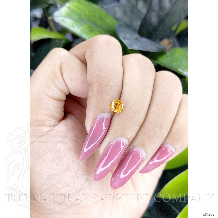 0.66 Ct. Orangish Yellow Sapphire from Ceylon (Sri Lanka)