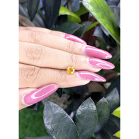 0.66 Ct. Orangish Yellow Sapphire from Ceylon (Sri Lanka) Life Style