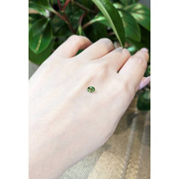 0.49 Ct. Yellowish Green Sapphire from Thailand Life Style
