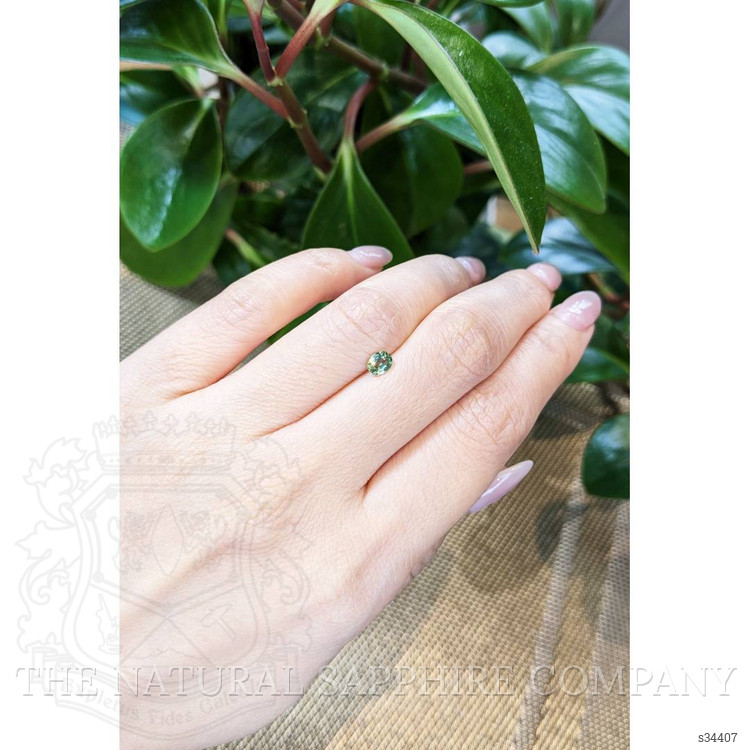0.47 Ct. Yellowish Green Sapphire from Thailand