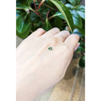 0.47 Ct. Yellowish Green Sapphire from Thailand Life Style