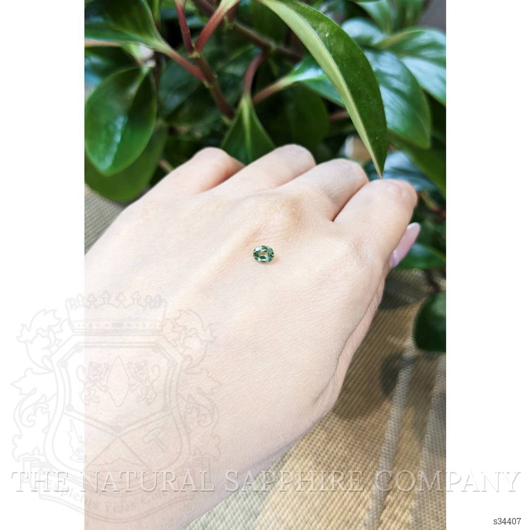 0.47 Ct. Yellowish Green Sapphire from Thailand