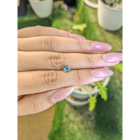 0.73 Ct. Greenish Blue Sapphire from Madagascar Life Style