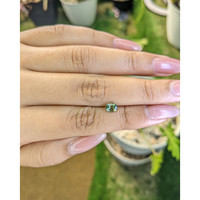 0.84 Ct. Yellowish Green Sapphire from Madagascar Life Style