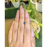 0.66 Ct. Bluish Green Sapphire from Madagascar Life Style