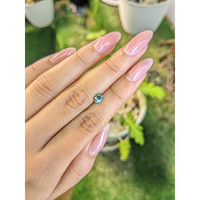 0.66 Ct. Bluish Green Sapphire from Madagascar Life Style