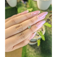 0.55 Ct. Yellowish Green Sapphire from Madagascar Life Style