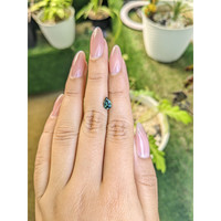 0.95 Ct. Bluish Green Sapphire from Madagascar Life Style