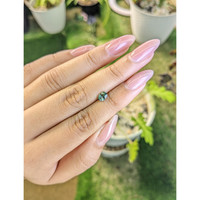 0.65 Ct. Green Sapphire from Madagascar Life Style