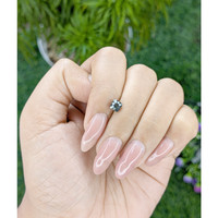 0.82 Ct. Bluish Green Sapphire from Madagascar Life Style