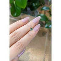 0.39 Ct. Bluish Green Sapphire from Madagascar Life Style