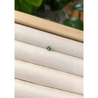 0.39 Ct. Bluish Green Sapphire from Madagascar Life Style