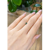 0.49 Ct. Yellowish Green Sapphire from Madagascar Life Style