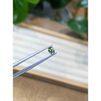 0.49 Ct. Yellowish Green Sapphire from Madagascar Life Style