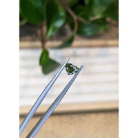 1.06 Ct. Yellowish Green Sapphire from Thailand Life Style