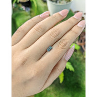 0.65 Ct. Bluish Green Sapphire from Madagascar Life Style