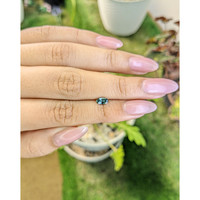 0.55 Ct. Bluish Green Sapphire from Madagascar Life Style