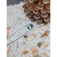 0.55 Ct. Bluish Green Sapphire from Madagascar Life Style