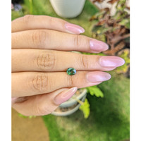 0.88 Ct. Bluish Green Sapphire from Madagascar Life Style