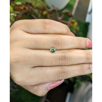 0.71 Ct. Yellowish Green Sapphire from Madagascar Life Style