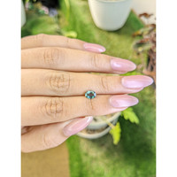 0.71 Ct. Bluish Green Sapphire from Madagascar Life Style