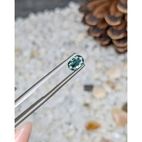 0.71 Ct. Bluish Green Sapphire from Madagascar Life Style