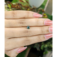 0.59 Ct. Bluish Green Sapphire from Madagascar Life Style