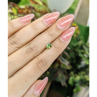 0.66 Ct. Yellowish Green Sapphire from Madagascar Life Style