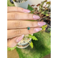 0.79 Ct. Bluish Green Sapphire from Madagascar Life Style