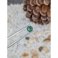0.79 Ct. Bluish Green Sapphire from Madagascar Life Style
